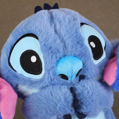 Peluche Stitch musicale avec respiration, lumières et musique. Jouet apaisant Disney pour bébé et enfant, idéale pour le sommeil et les cadeaux.